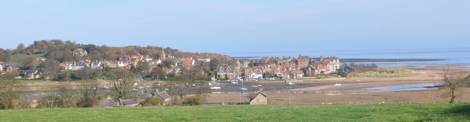 View of Alnmouth village and the estuary at low tide