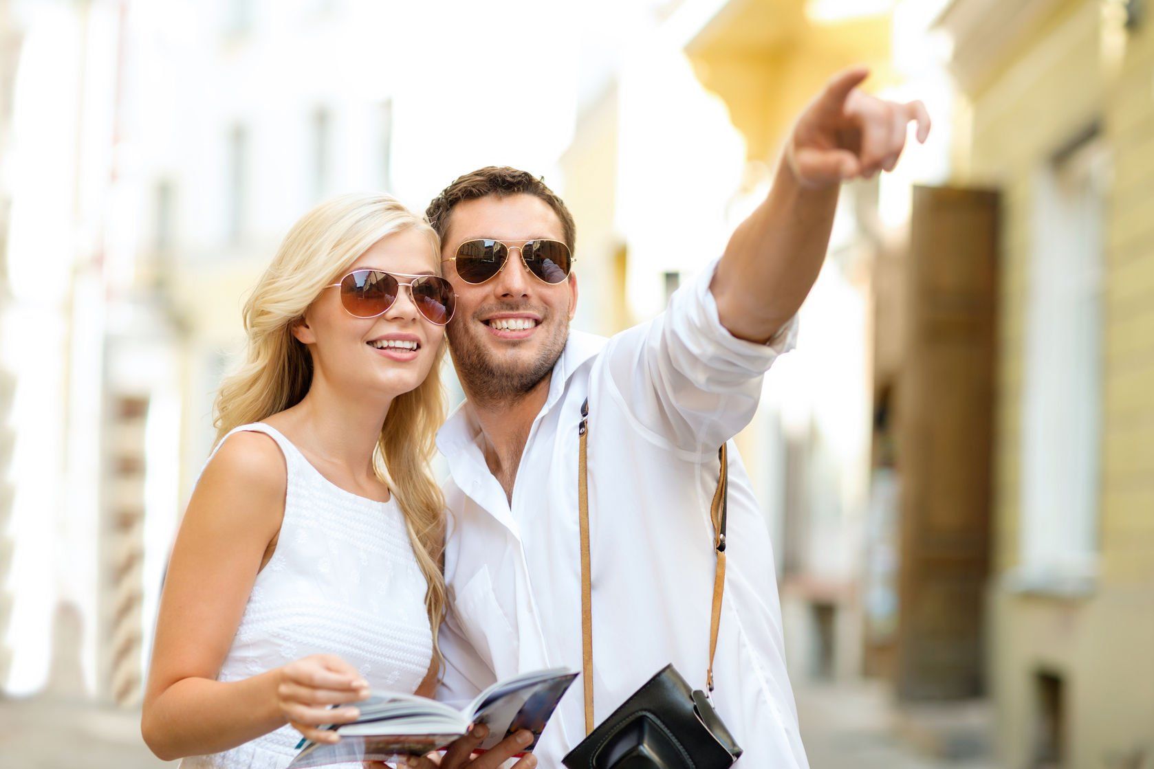A couple pointing at something interesting on vacation