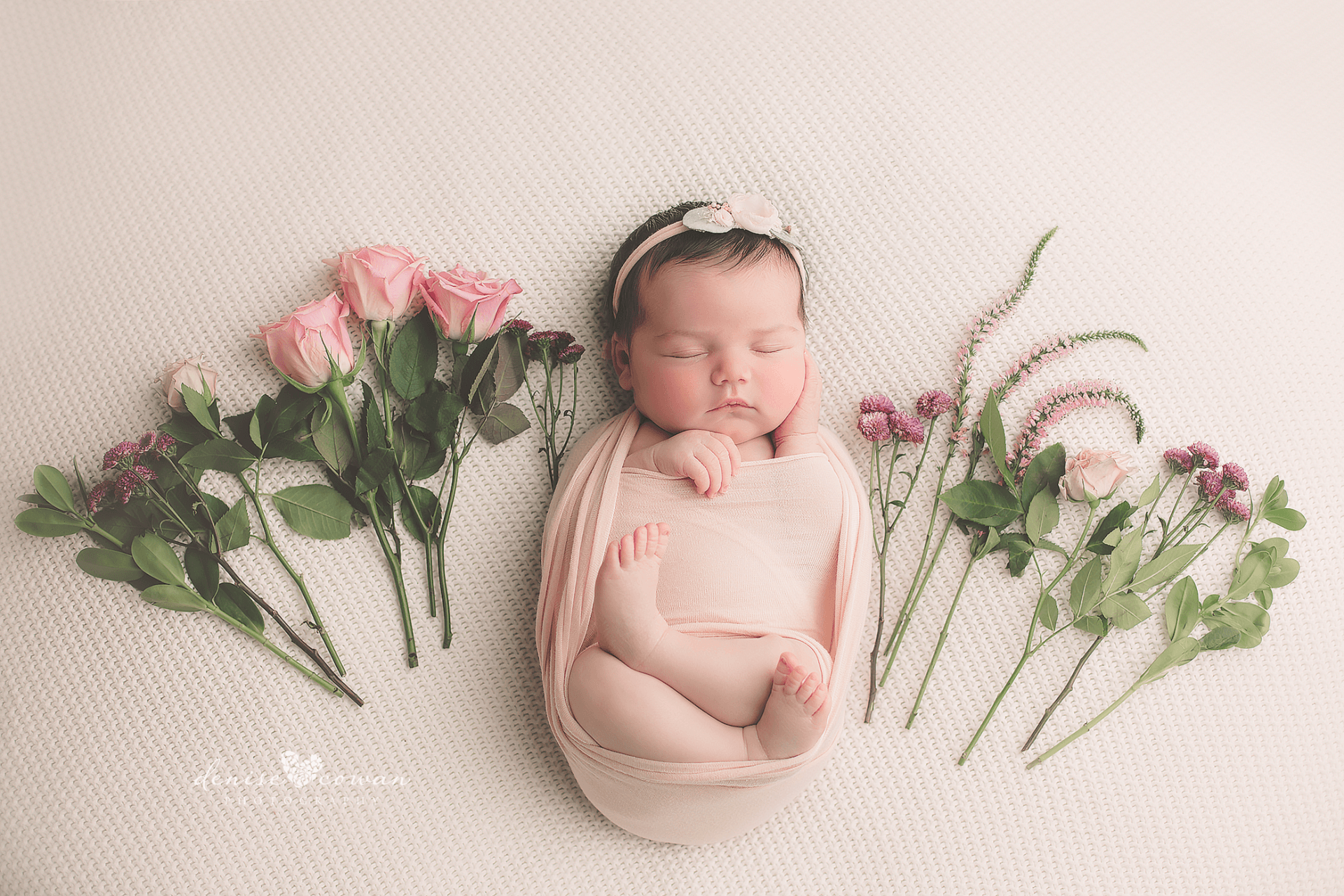 Wellspring Birth Center mascot with flowers