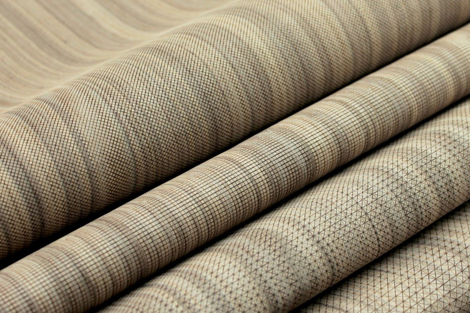 NUO in Fineline walnut veneer showing four available engravings