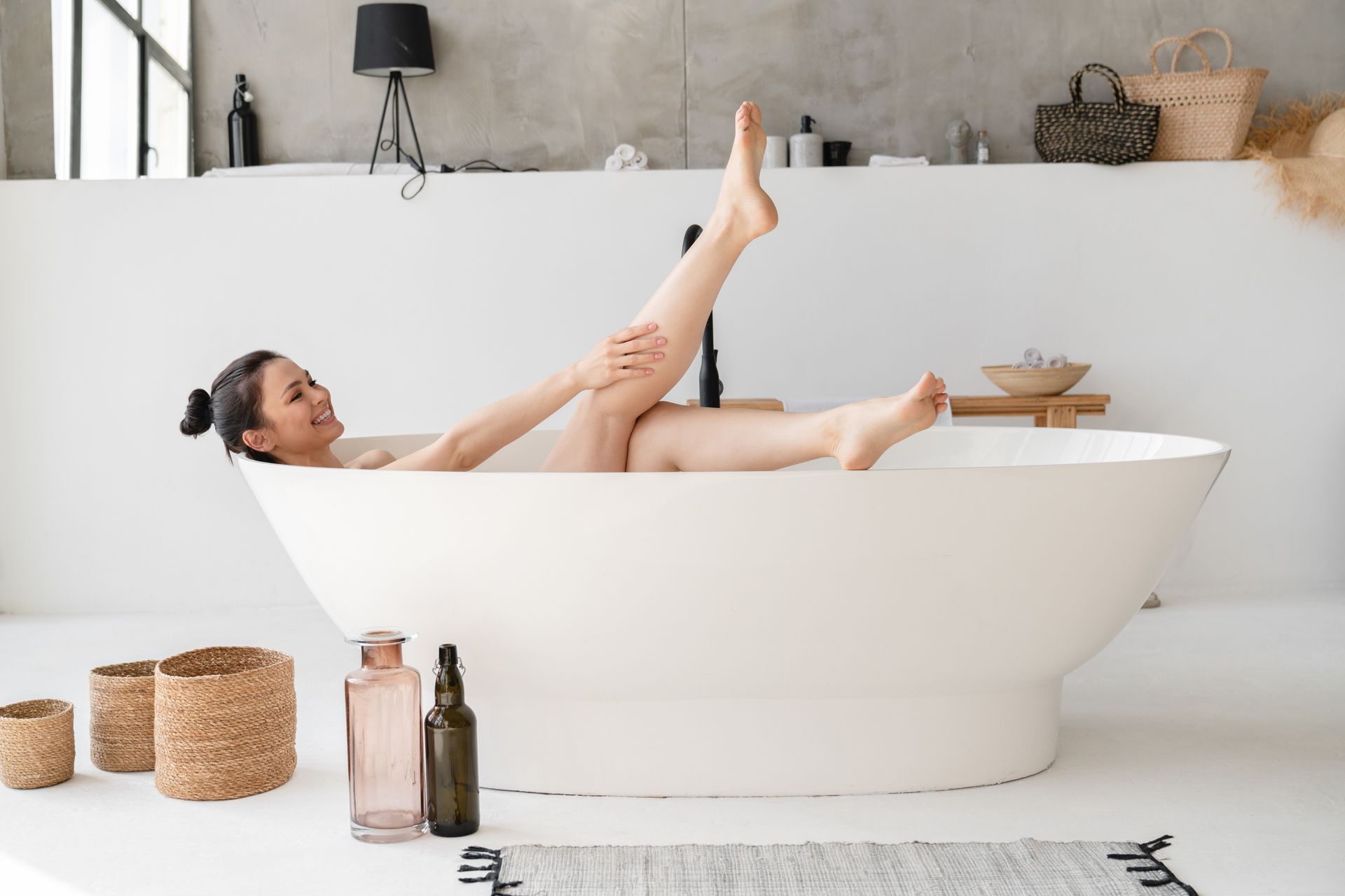 Woman in bathtub with clean water
