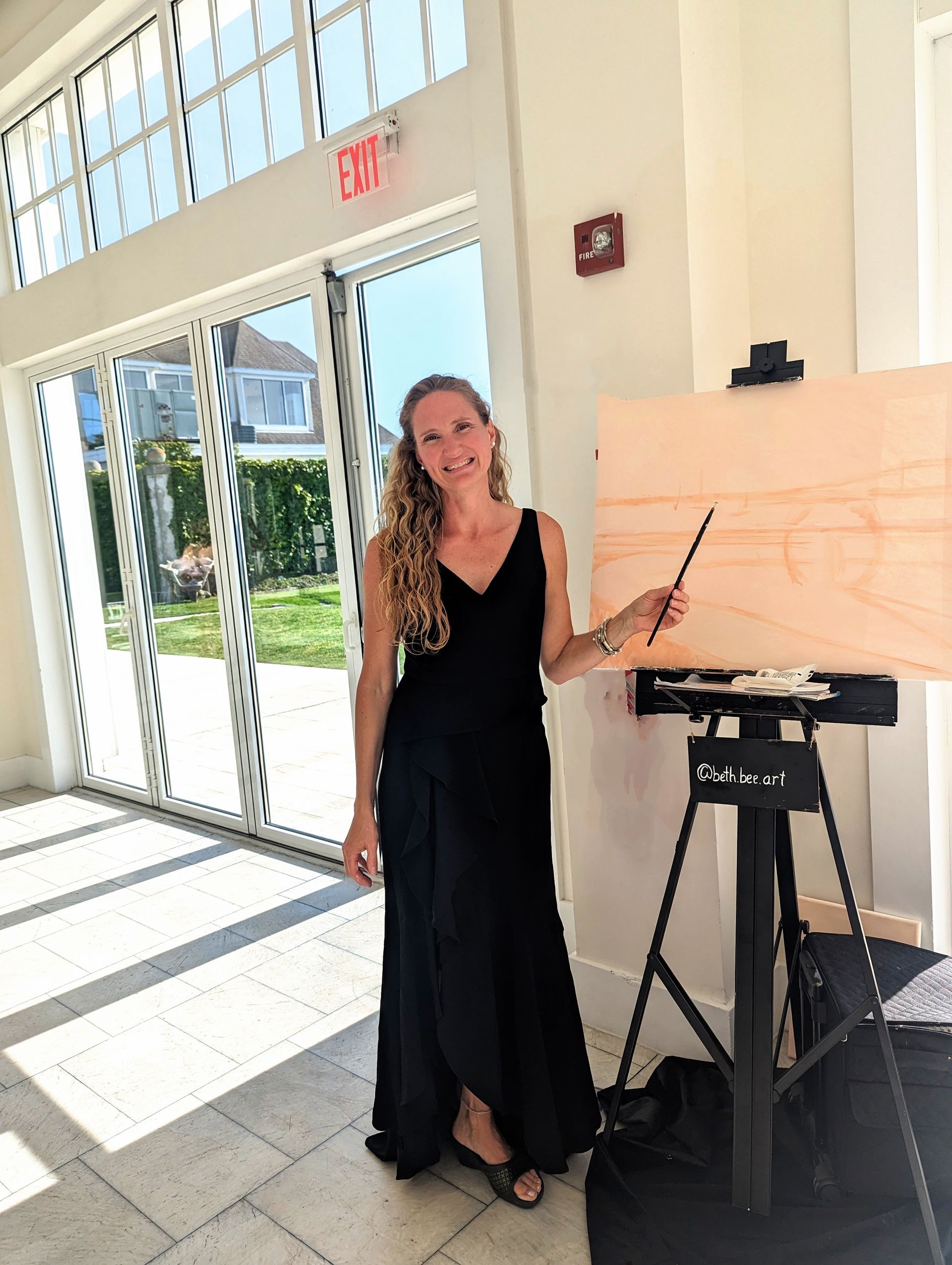 Local wedding artist Bethany Browne painting live at a wedding at Belle Mer in Newport, RI