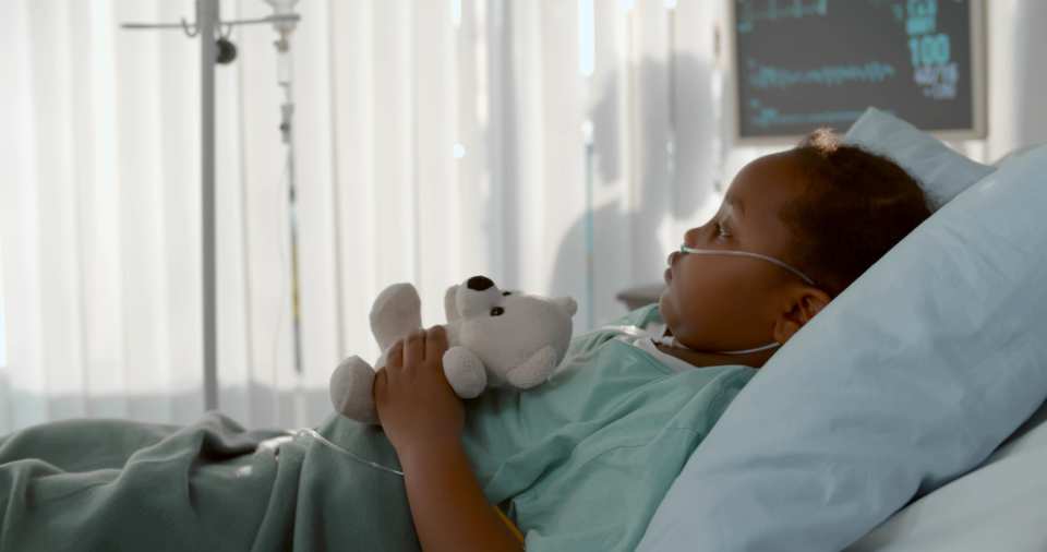 a sick child in a hospital