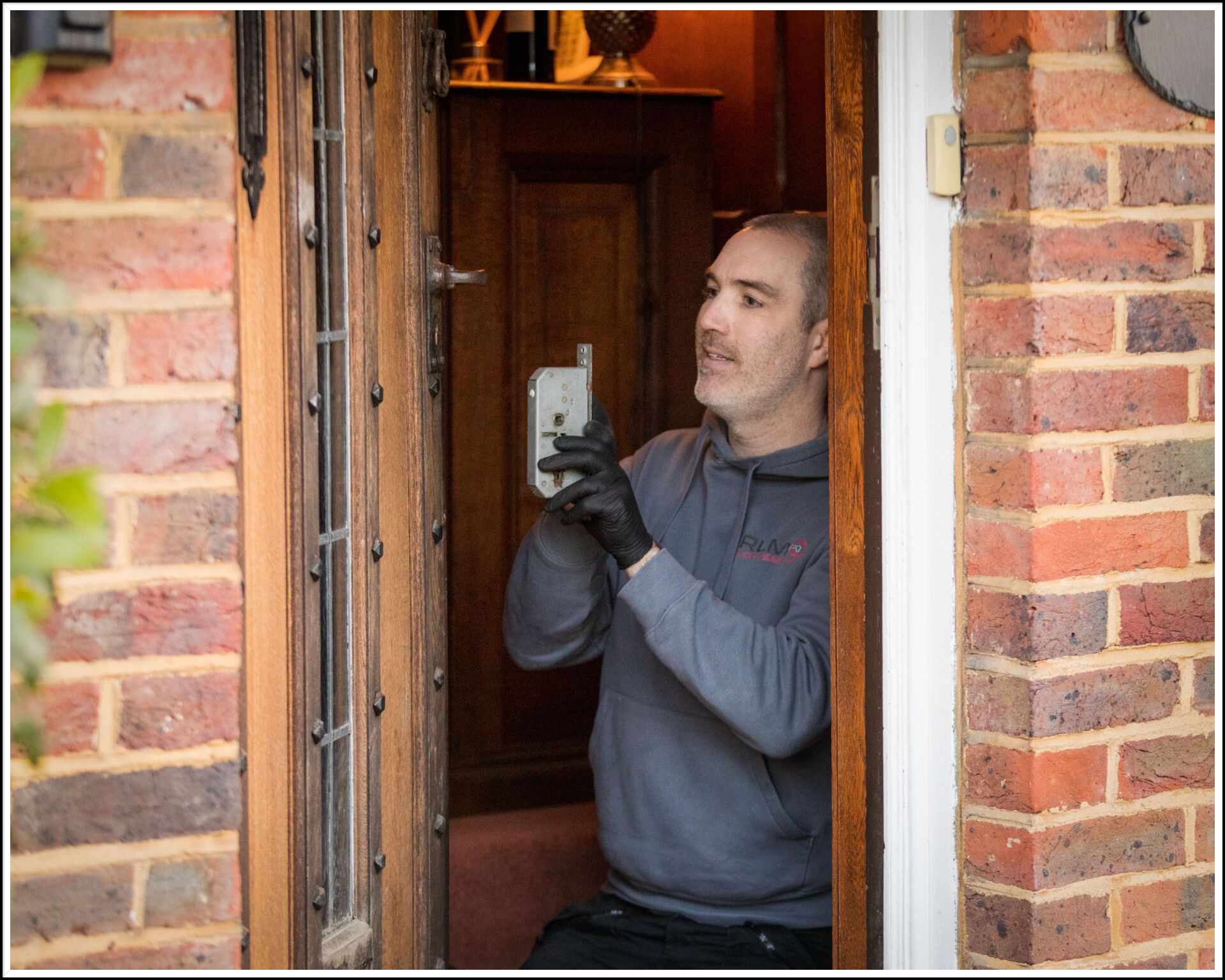 RLM Locksmith fitting new locks in Lingfield