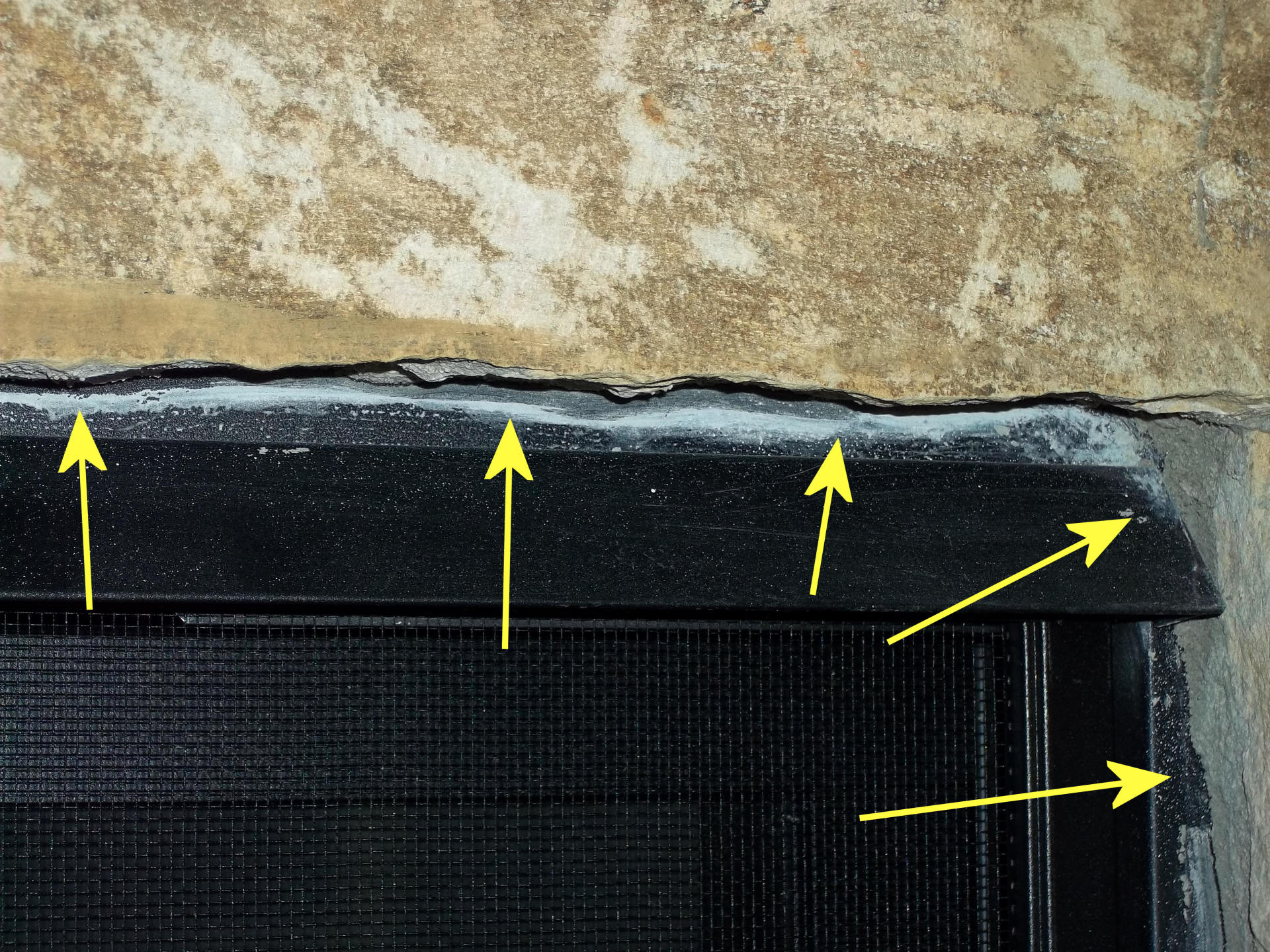 Yet another photo showing the masonry sloppiness surrounding our fireplace in the family room.
