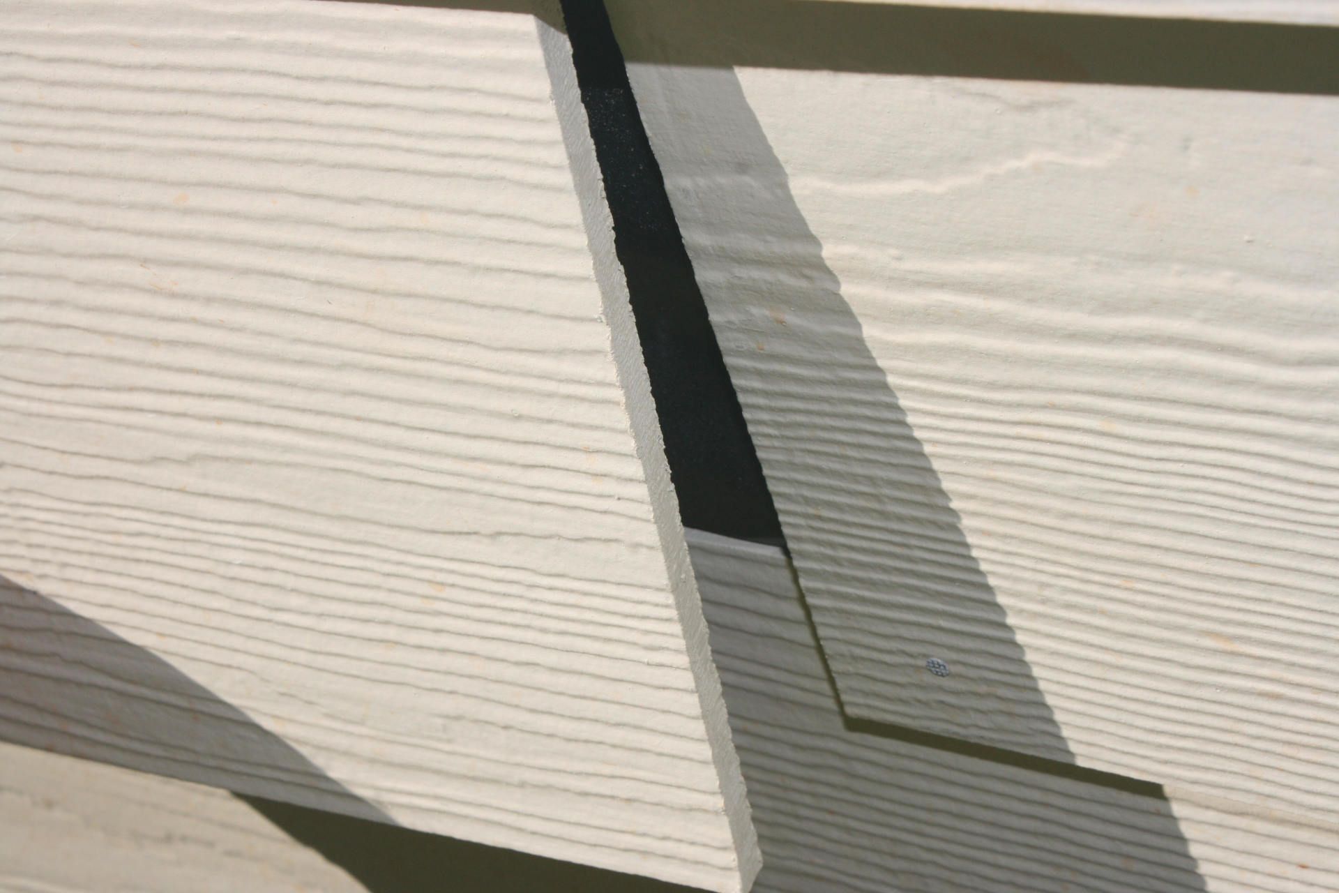 Another, more extreme example of siding pulling away from the house.