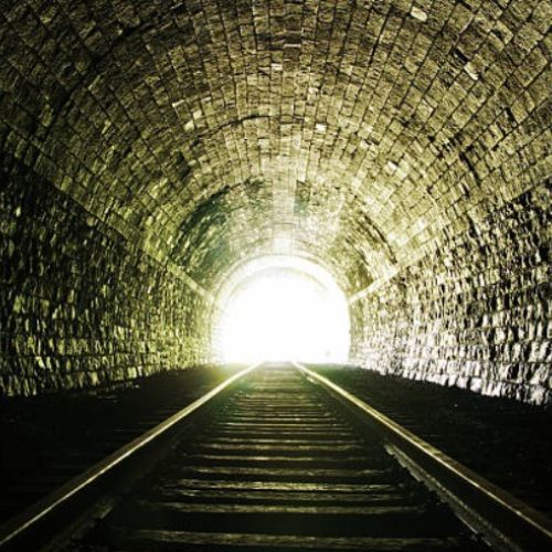 Looking out of a tunnel into sunlight, a symbol of recovery from KPU in horses