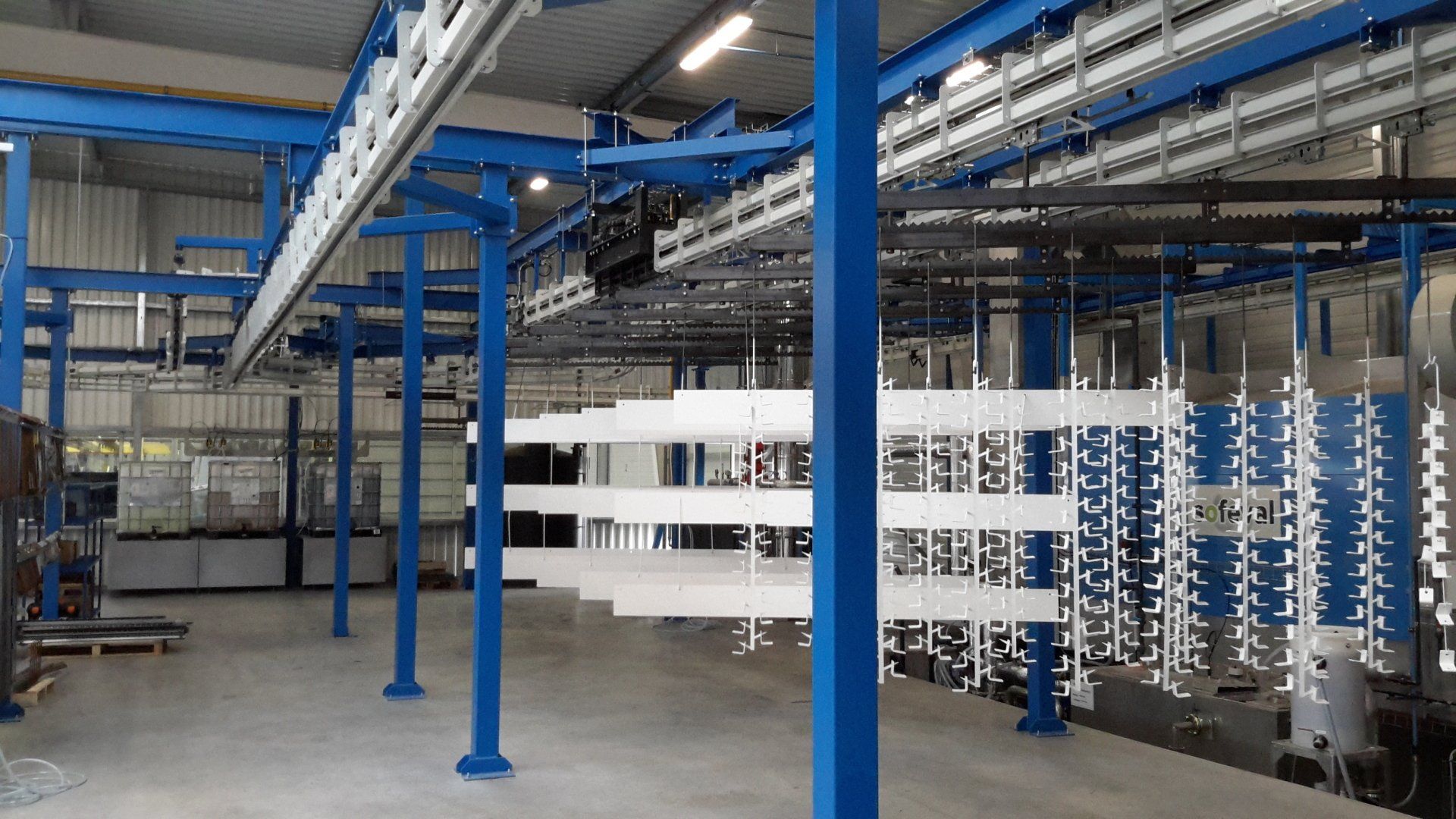 Convoyeur birail motorisé secteur traitement de surface, transfert et accumulation automatique