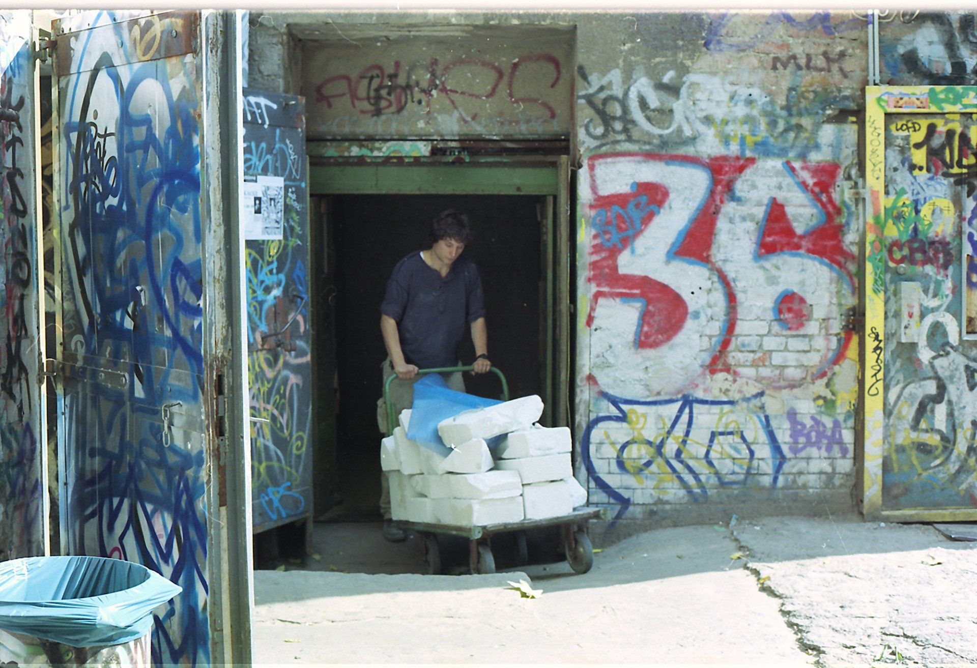 Sebastian Bieniek entering the lift of the Kunsthaus Tacheles, with the Sebastian Bieniek entering the lift of the Kunsthaus Tacheles, with the