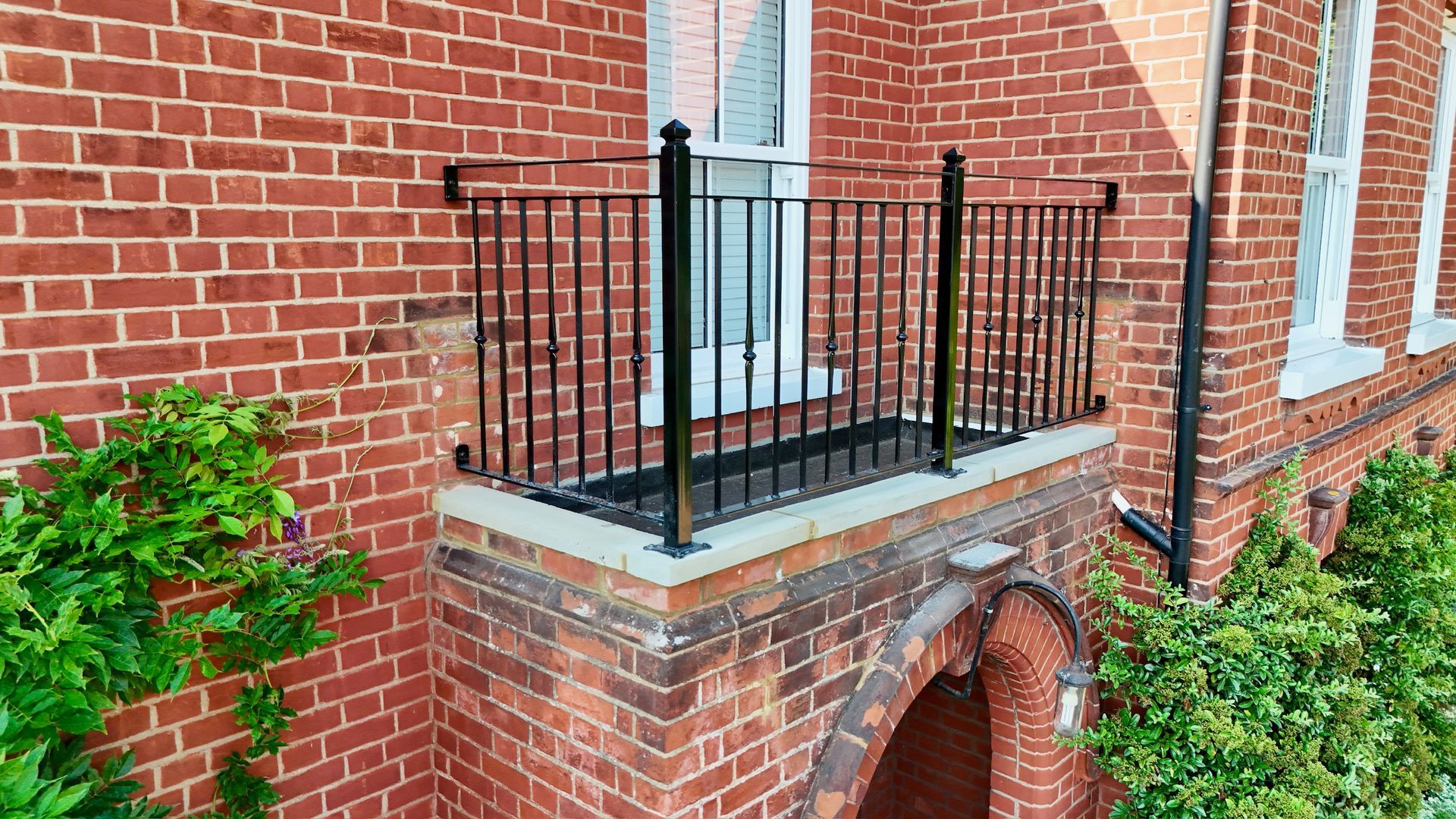 balcony balustrade powder coated black, decorative forged steel spindles, galvanised, fabrication, installation