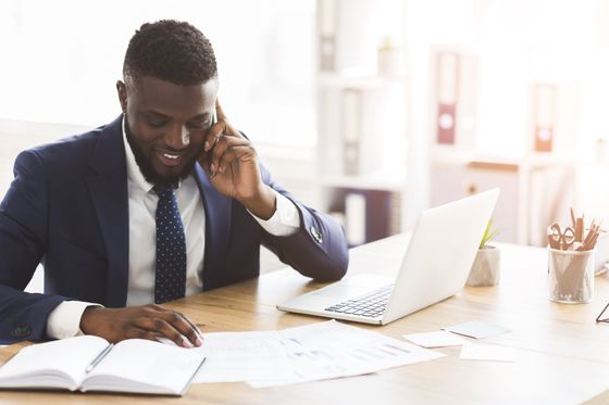 Business Services Image of person doing a business transaction over the phone