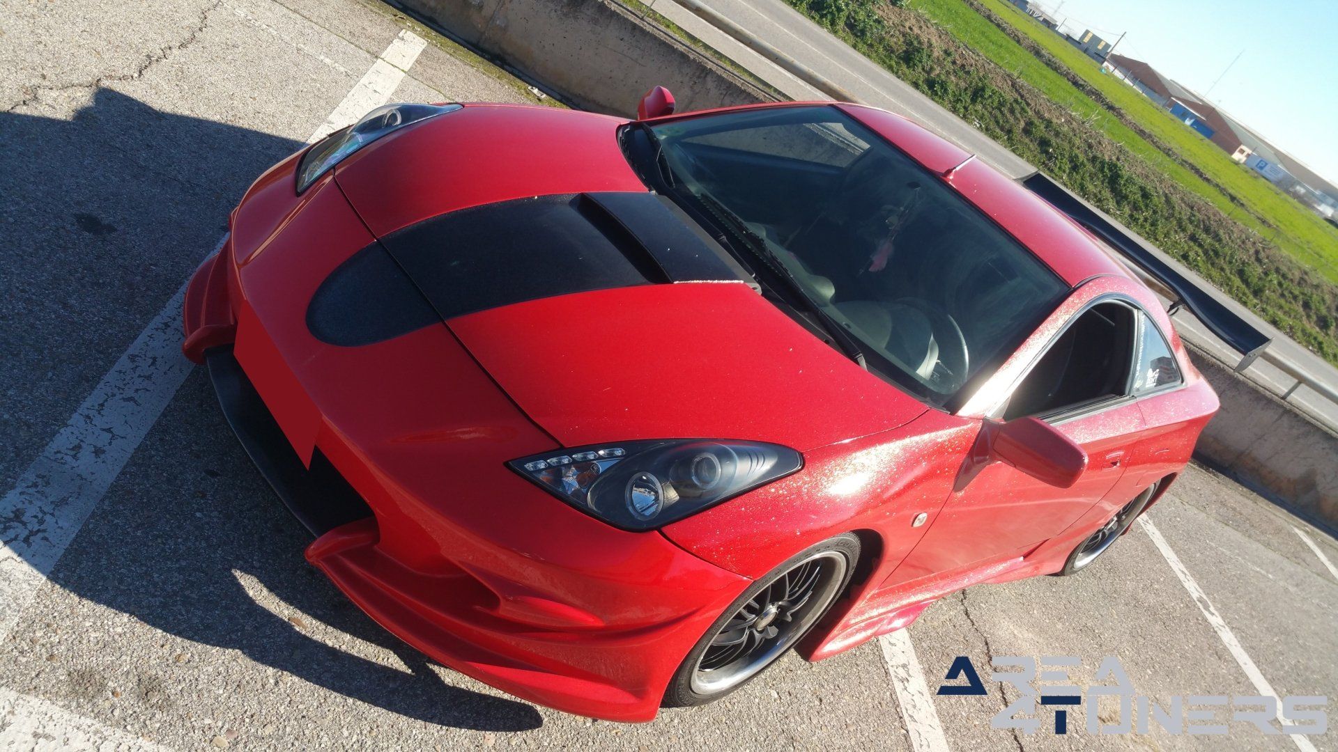 Imagen reportaje coche Tuning Toyota Celica Hemoglobine Imagen perteneciente al reportaje fotográfico de la revista Tuning de publicación diaria Area4tuners.es sobre un Toyota Celica