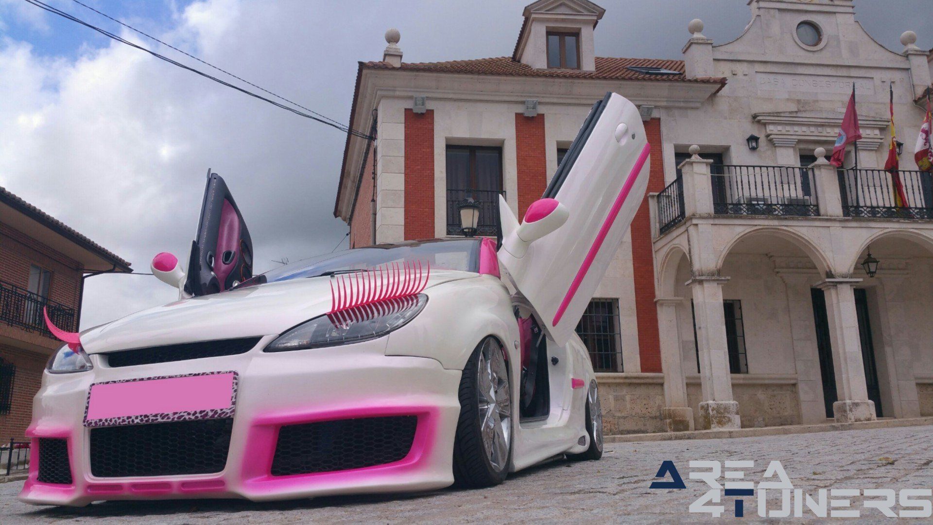 Imagen reportaje coche Tuning Peugeot 206 Mirada Femenina Imagen perteneciente al reportaje fotográfico de la revista Tuning de publicación diaria Area4tuners.es sobre un Peugeot 206