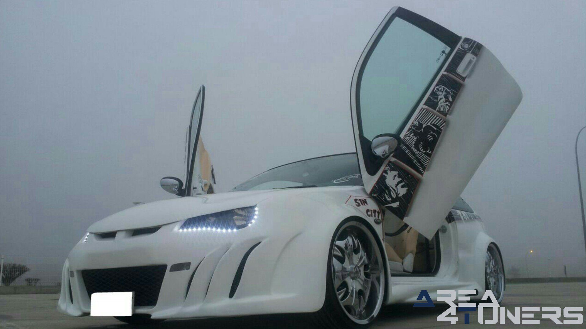 Imagen reportaje coche Tuning Mg Zr Sin City Imagen perteneciente al reportaje de coche Tuning, de la revista Area4tuners.es sobre un Mg Zr