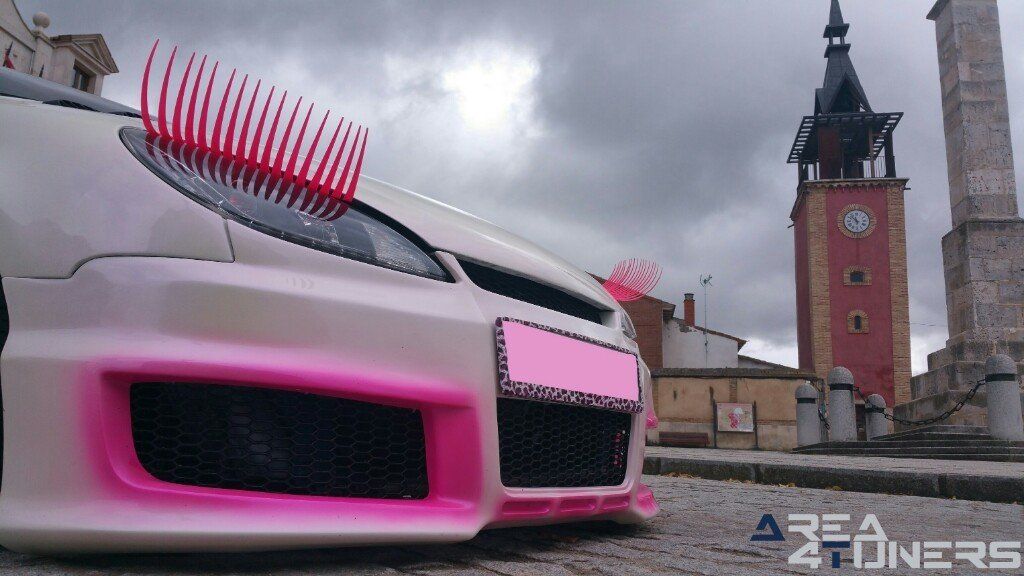 Imagen reportaje coche Tuning Peugeot 206 Mirada Femenina Imagen perteneciente al reportaje fotográfico de la revista Tuning de publicación diaria Area4tuners.es sobre un Peugeot 206