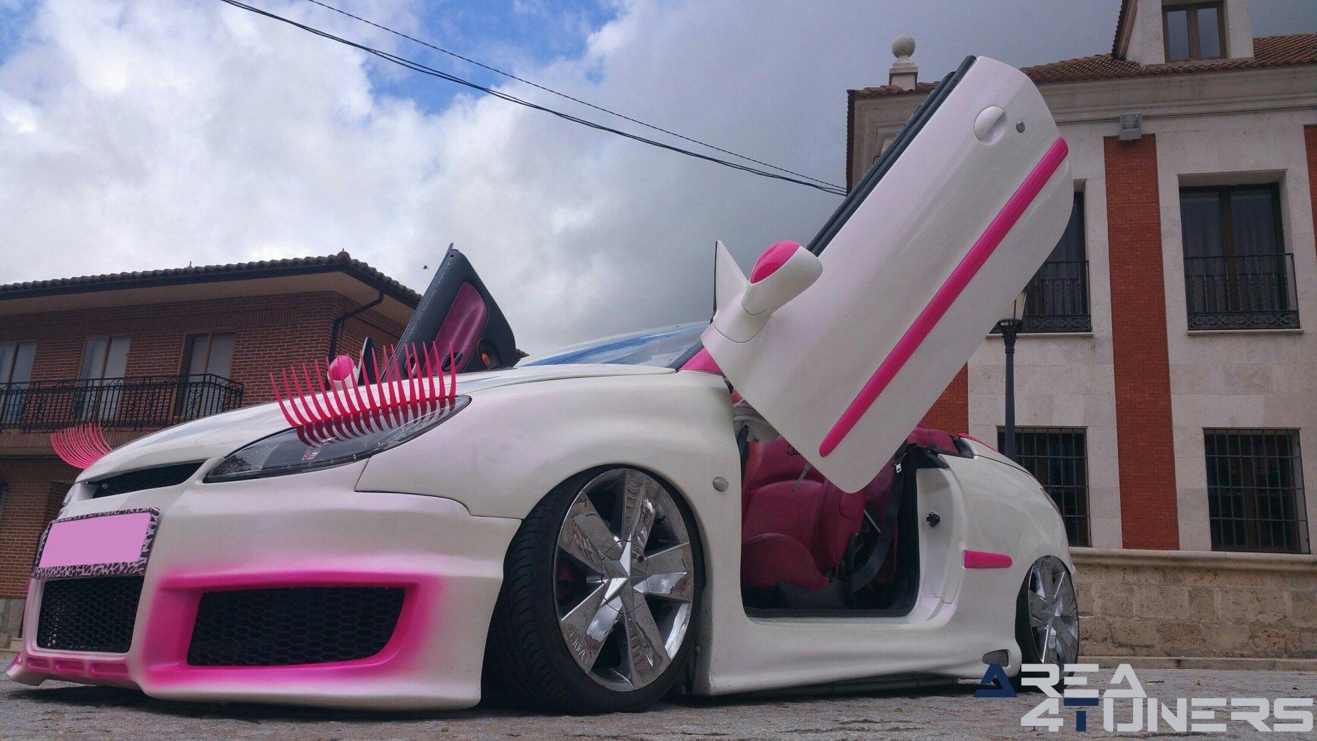 Imagen reportaje coche Tuning Peugeot 206 Mirada Femenina Imagen perteneciente al reportaje fotográfico de la revista Tuning de publicación diaria Area4tuners.es sobre un Peugeot 206
