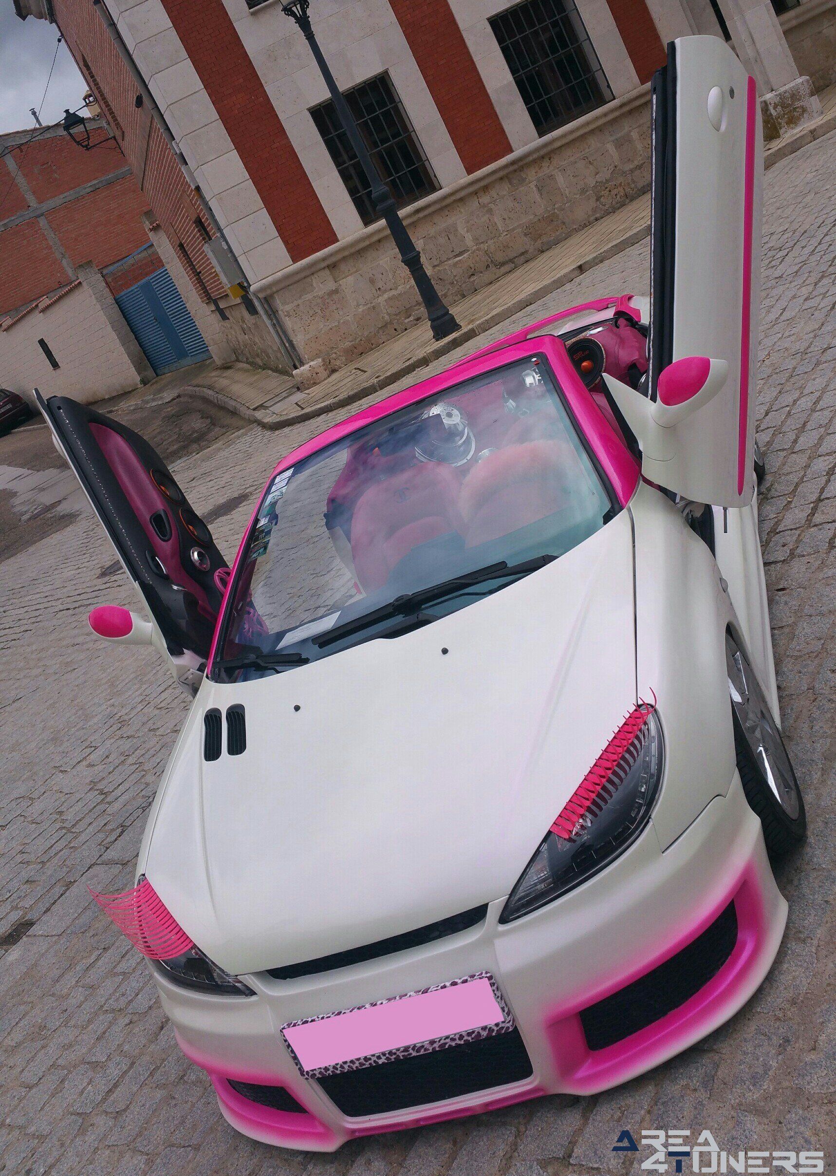 Imagen reportaje coche Tuning Peugeot 206 Mirada Femenina Imagen perteneciente al reportaje fotográfico de la revista Tuning de publicación diaria Area4tuners.es sobre un Peugeot 206