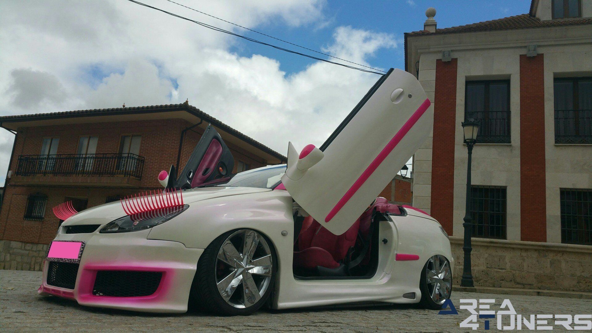 Imagen reportaje coche Tuning Peugeot 206 Mirada Femenina Imagen perteneciente al reportaje fotográfico de la revista Tuning de publicación diaria Area4tuners.es sobre un Peugeot 206