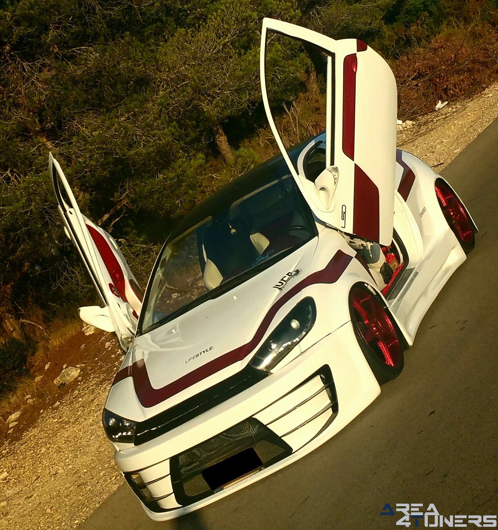 Imagen reportaje coche Tuning Peugeot 206 Doscirocco Imagen perteneciente al reportaje de coche Tuning, de la revista Area4tuners.es sobre un Peugeot 206