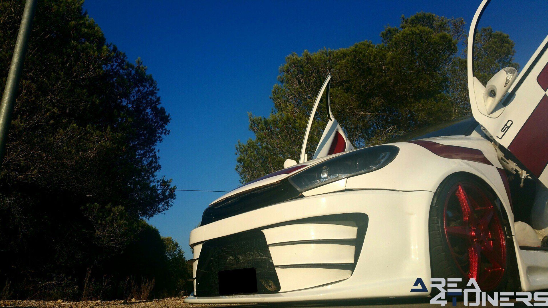 Imagen reportaje coche Tuning Peugeot 206 Doscirocco Imagen perteneciente al reportaje de coche Tuning, de la revista Area4tuners.es sobre un Peugeot 206