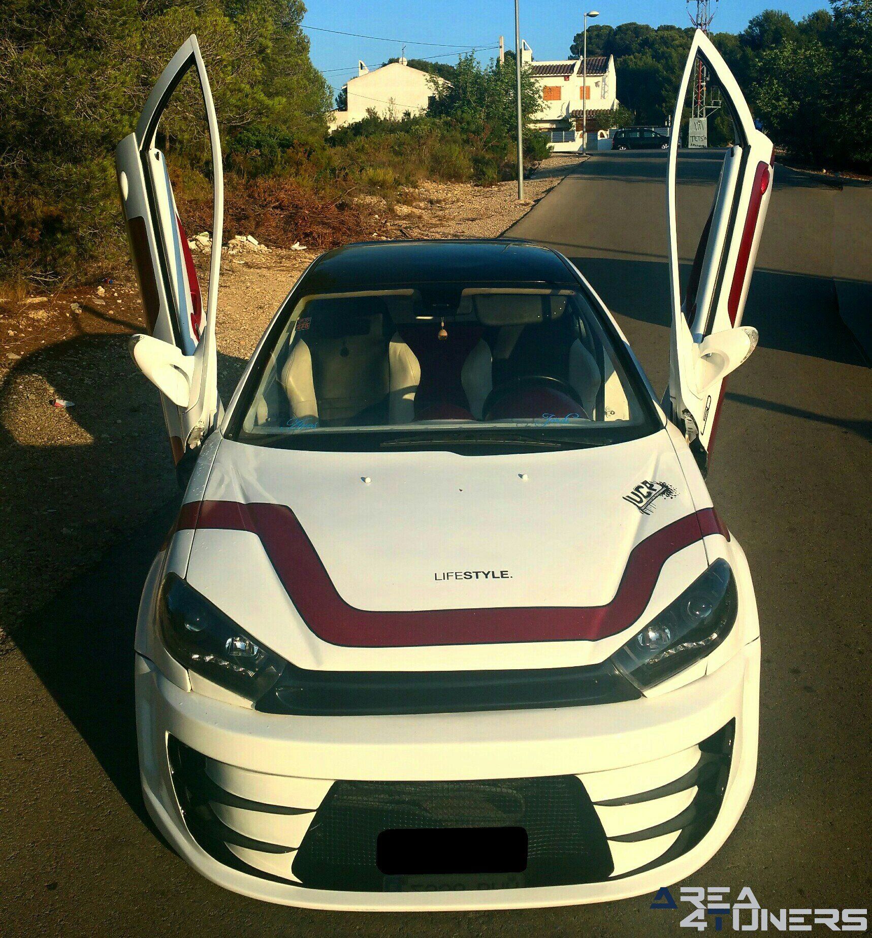 Imagen reportaje coche Tuning Peugeot 206 Doscirocco Imagen perteneciente al reportaje de coche Tuning, de la revista Area4tuners.es sobre un Peugeot 206