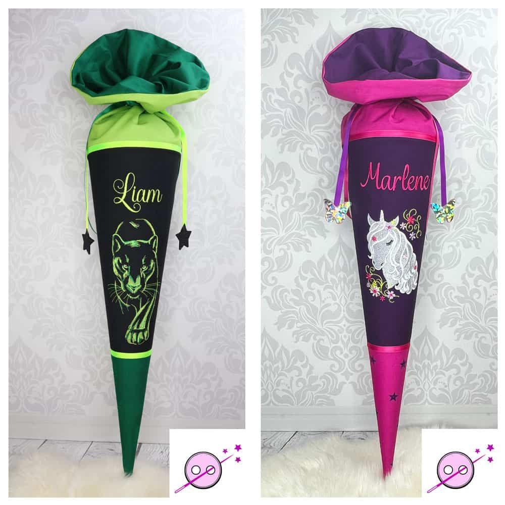 Zwei Schultüten aus Stoff. Eine in grün mit einem gestickten Panther drauf und eine in Pink mit einem gestickten Einhorn,