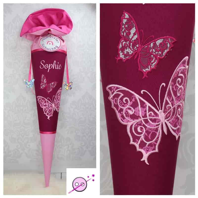 Schultüte in verschiedenen pink Tönen mit 2 gestickten Schmetterlingen. Die Schultüte ist aus Stoff.