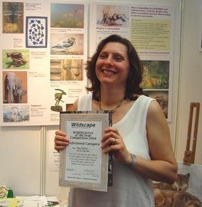 Photograph of Brighton Artist Troy Ohlson receiving her Wildlife Art Prize in London
