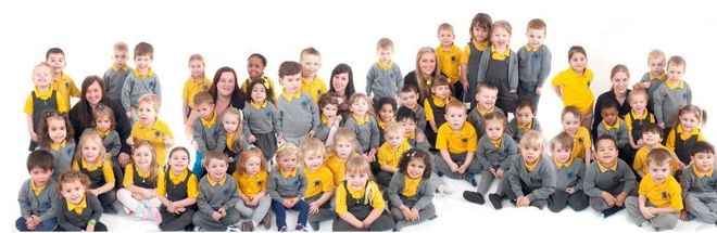 nursery group of children in nursery uniform