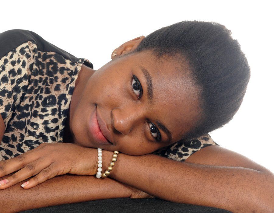 lady with her head laying on folded arms