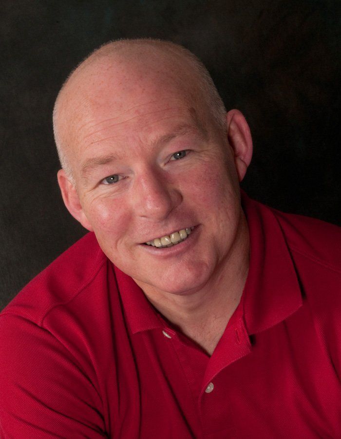 man in red shirt smiling