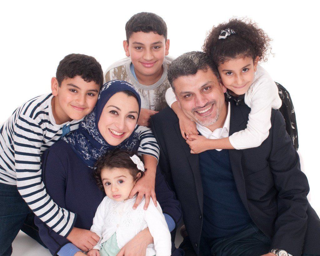 informal studio family informal studio portrait of mum dad and four children