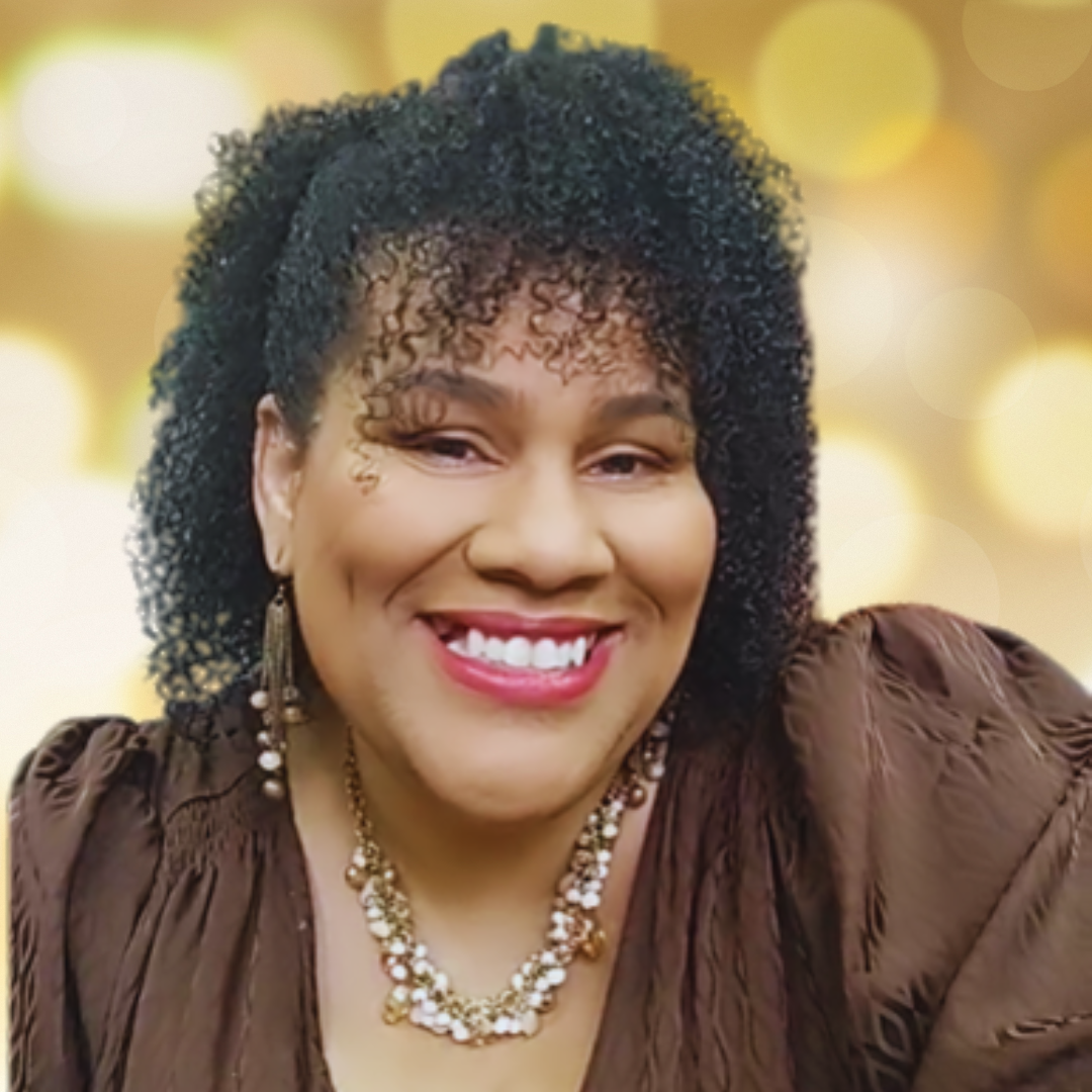 Fatima Bey, MindShift Coach and podcast host, smiling warmly in a professional headshot.