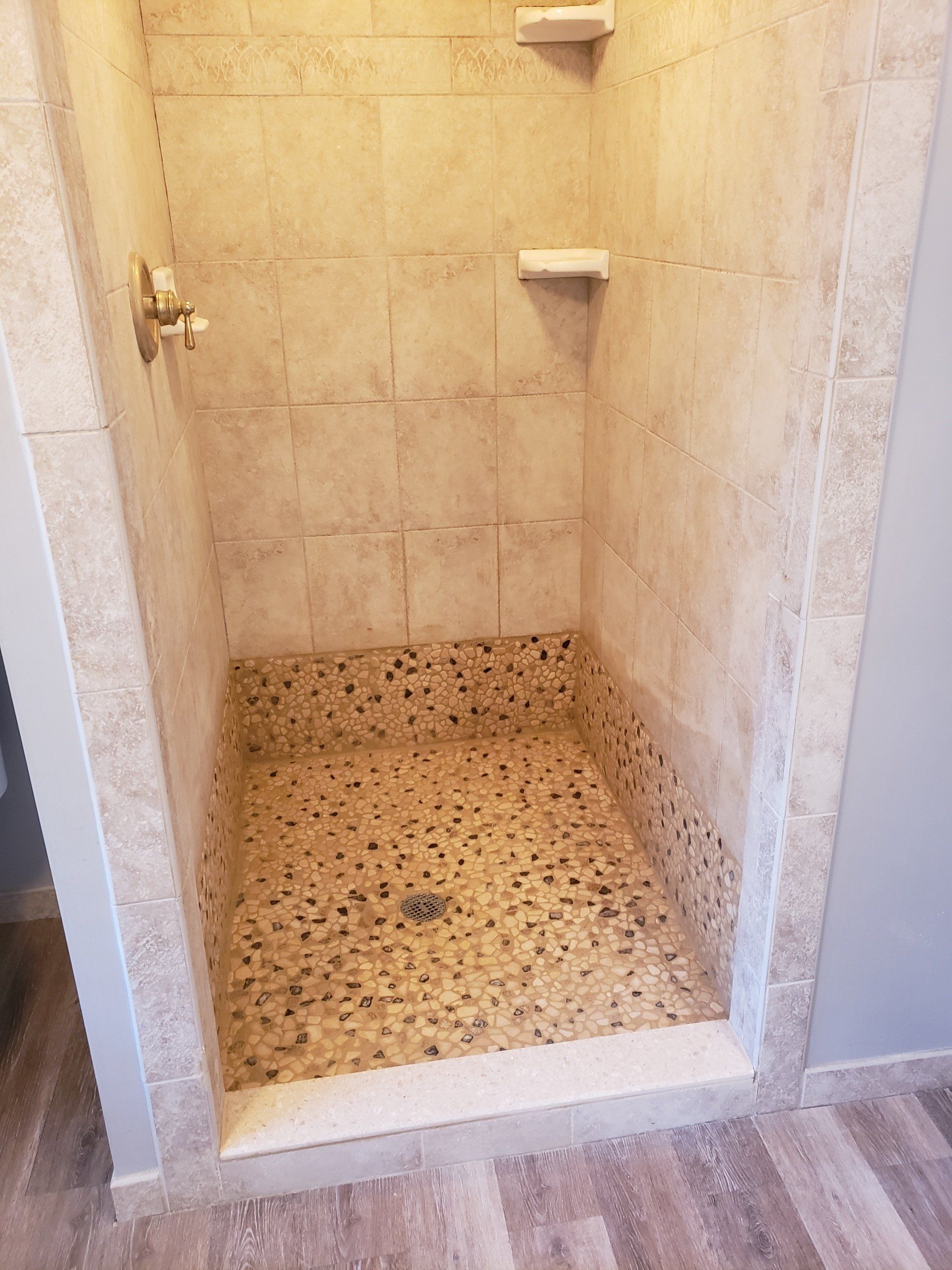 pebble shower floor and tuscan style shower wall tiles in Glenside bathroom remodel