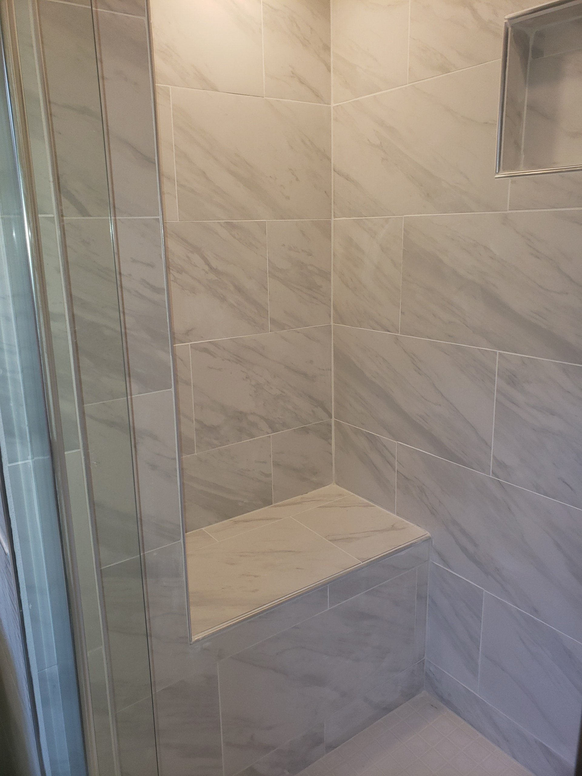 tiled shower bench in bathroom remodel