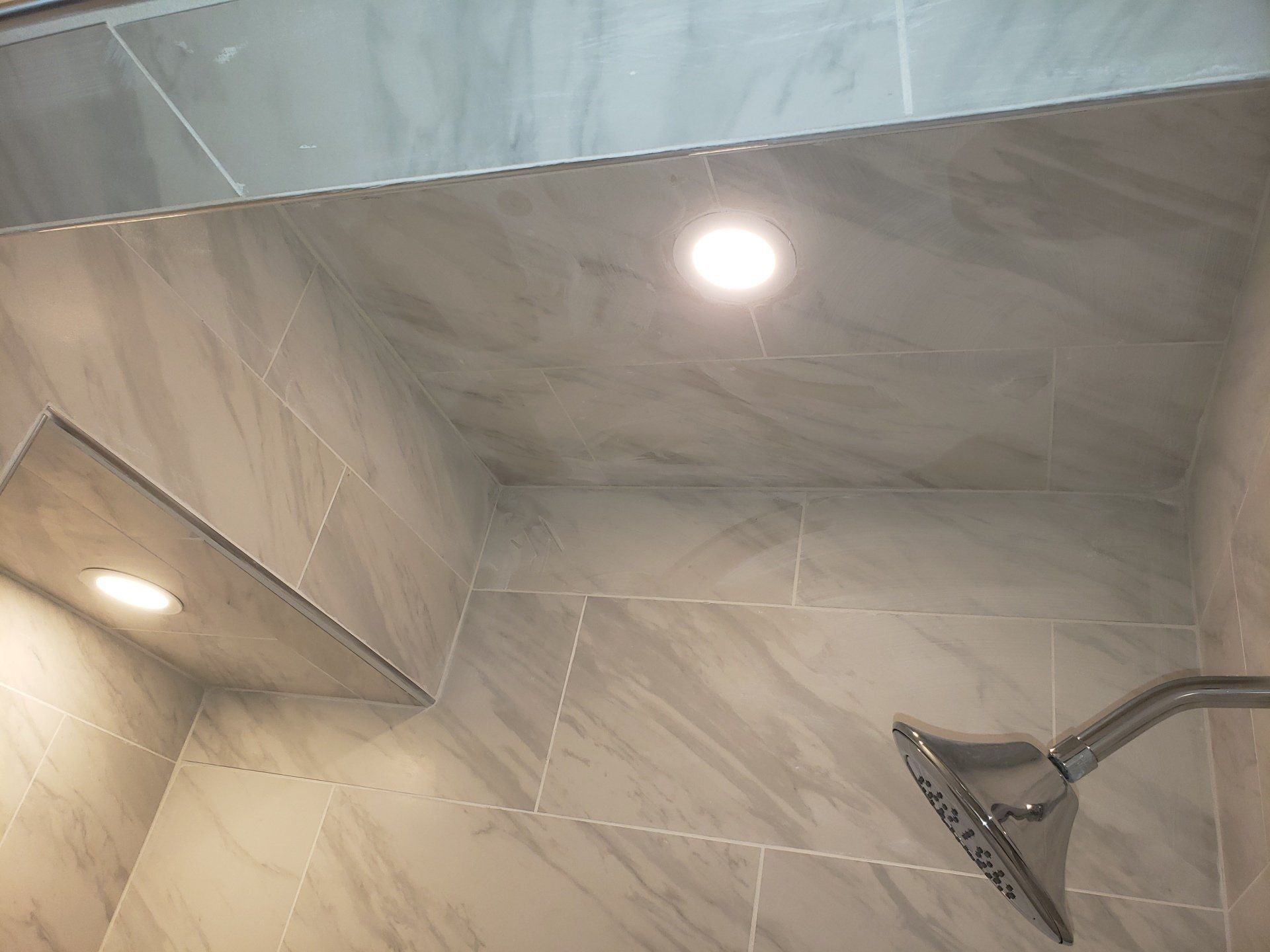 close up of tile ceiling and pocket lights in elkins park shower stall remodel