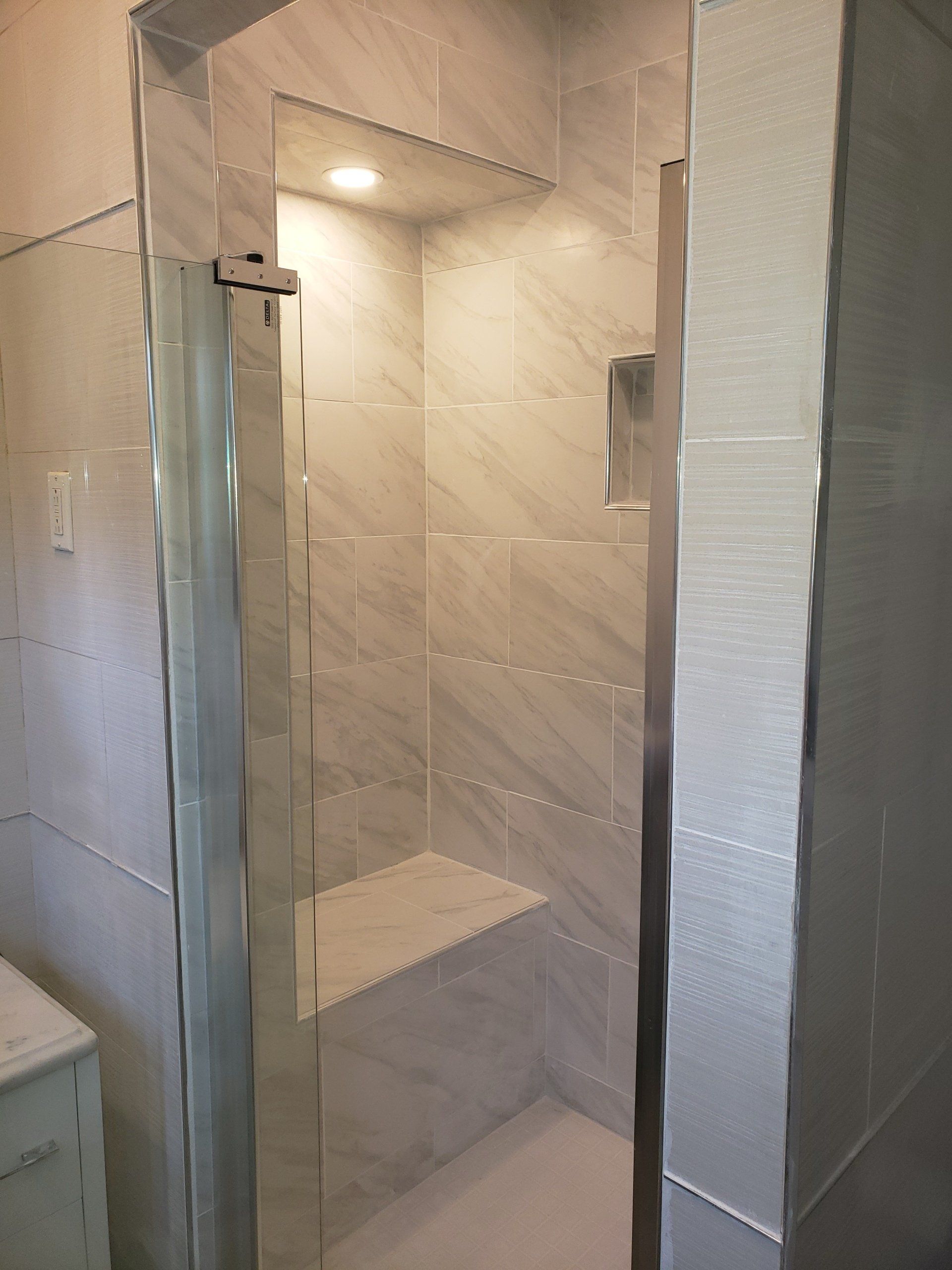 floor to ceiling tile remodel and expansion shower stall in elkins park with custom bench