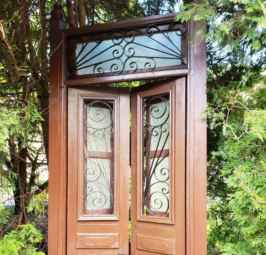antique door refinished against ivy background