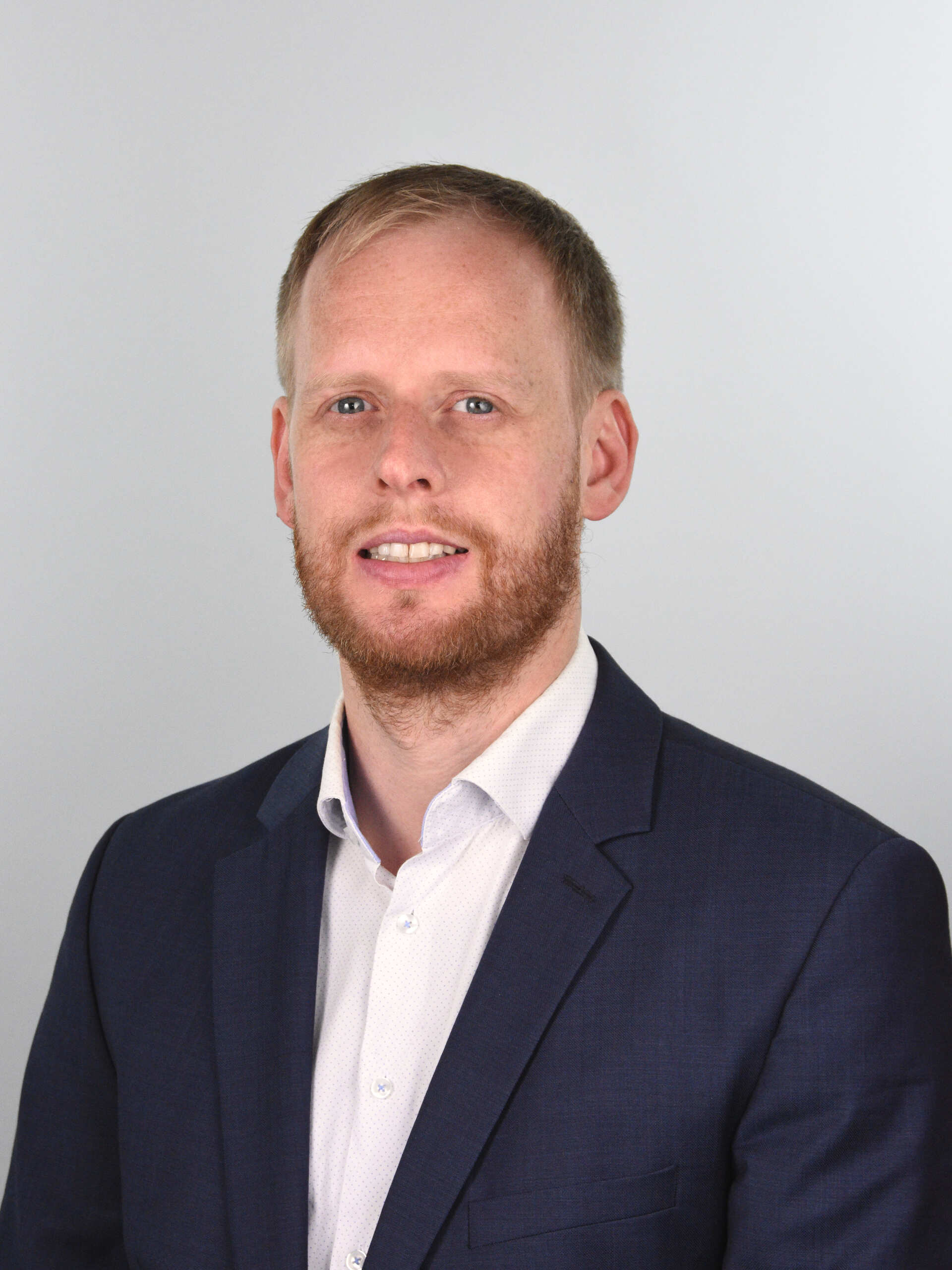 Portrait von Abteilungsleiter Doktor Tim Radel.