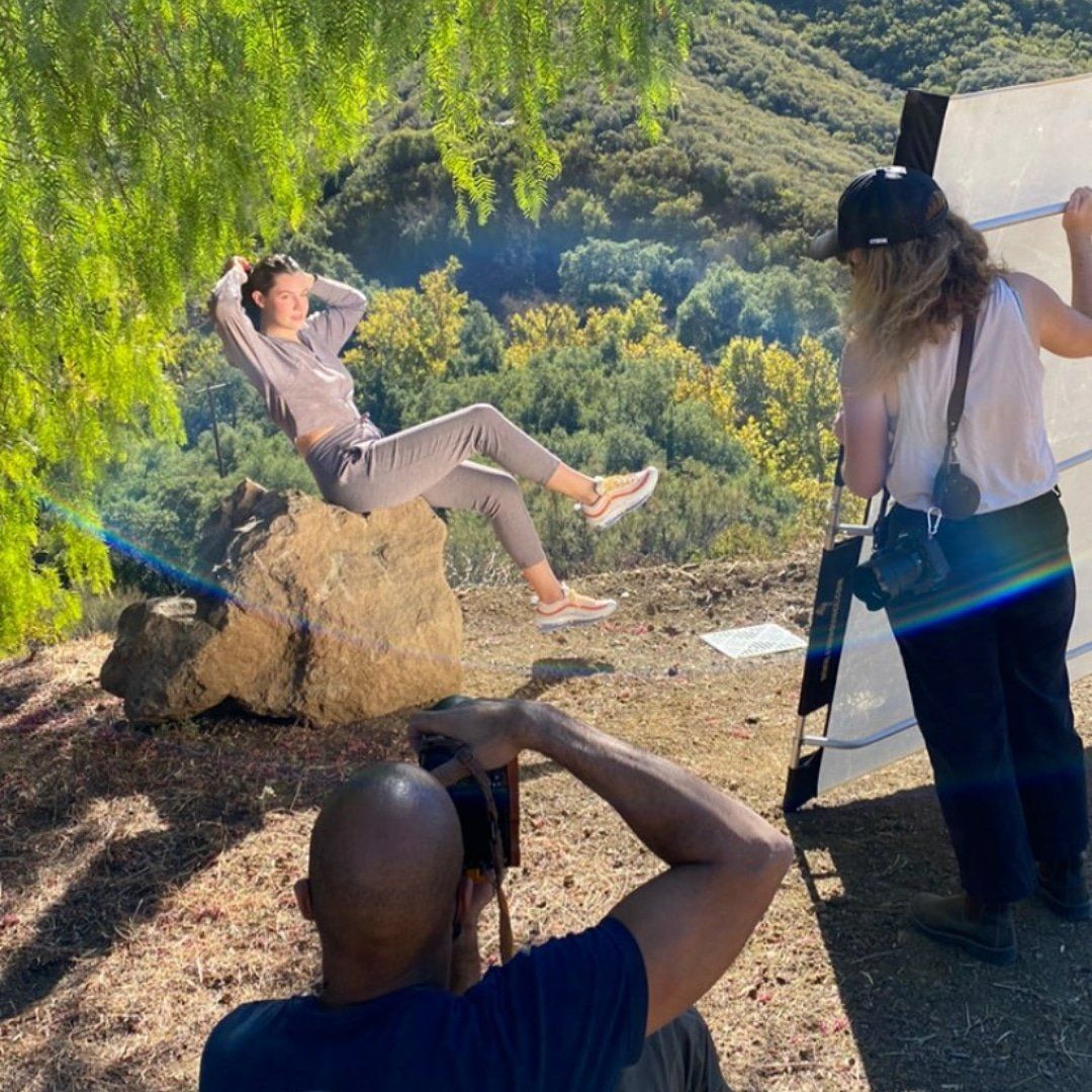 Picture from clothing line shoot on one of the many large rocks and pepper tree in the background