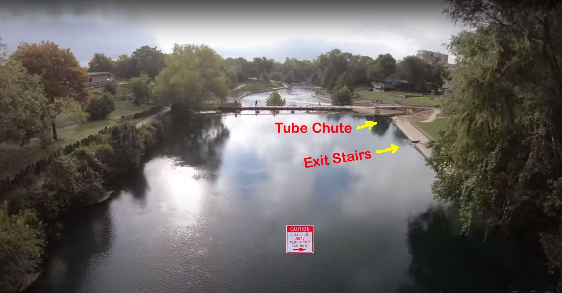 Aerial view of Sign - Caution - Tube Chute Ahead - Weak Swimmers Exit Now