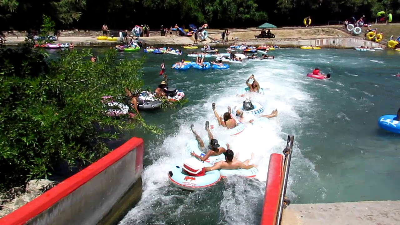 Blasting through the fun rapids of the New Braunfels Tube Chute with Texas Tubes