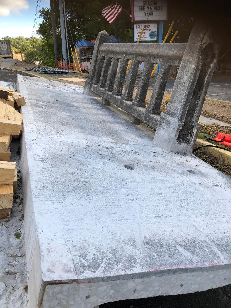 Removal of the old narrow sidewalk sections from the San Antonio Bridge, which will be replaced with new wider sidewalk sections for increased safety for pedestrians crossing the bridge - Texas Tubes on the Comal River in New Braunfels, TX