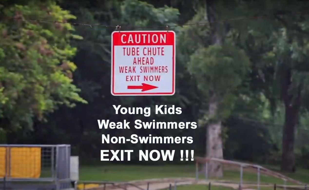 Caution Sign on the Comal River for Weak Swimmers to Exit the River and avoid the Tube Chute Caution Sign on the Comal River for Weak Swimmers to Exit the River and avoid the Tube Chute