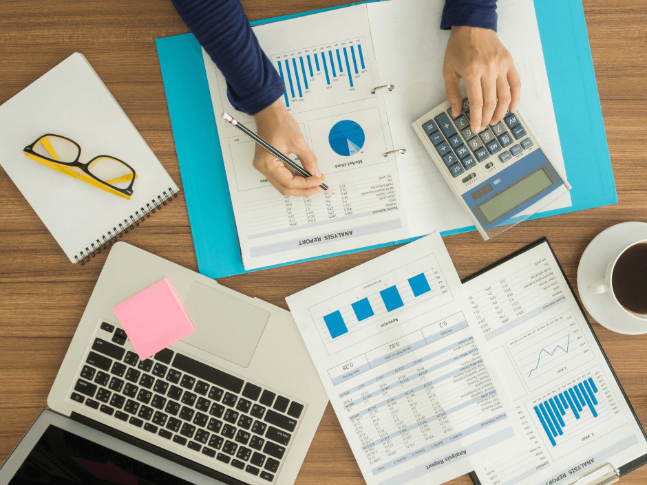 laptop bookkeeping accounting reports on desk