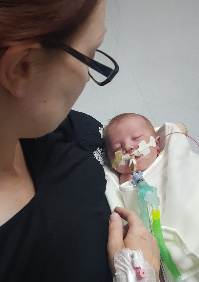 Georgina holding Gabriele shortly after birth