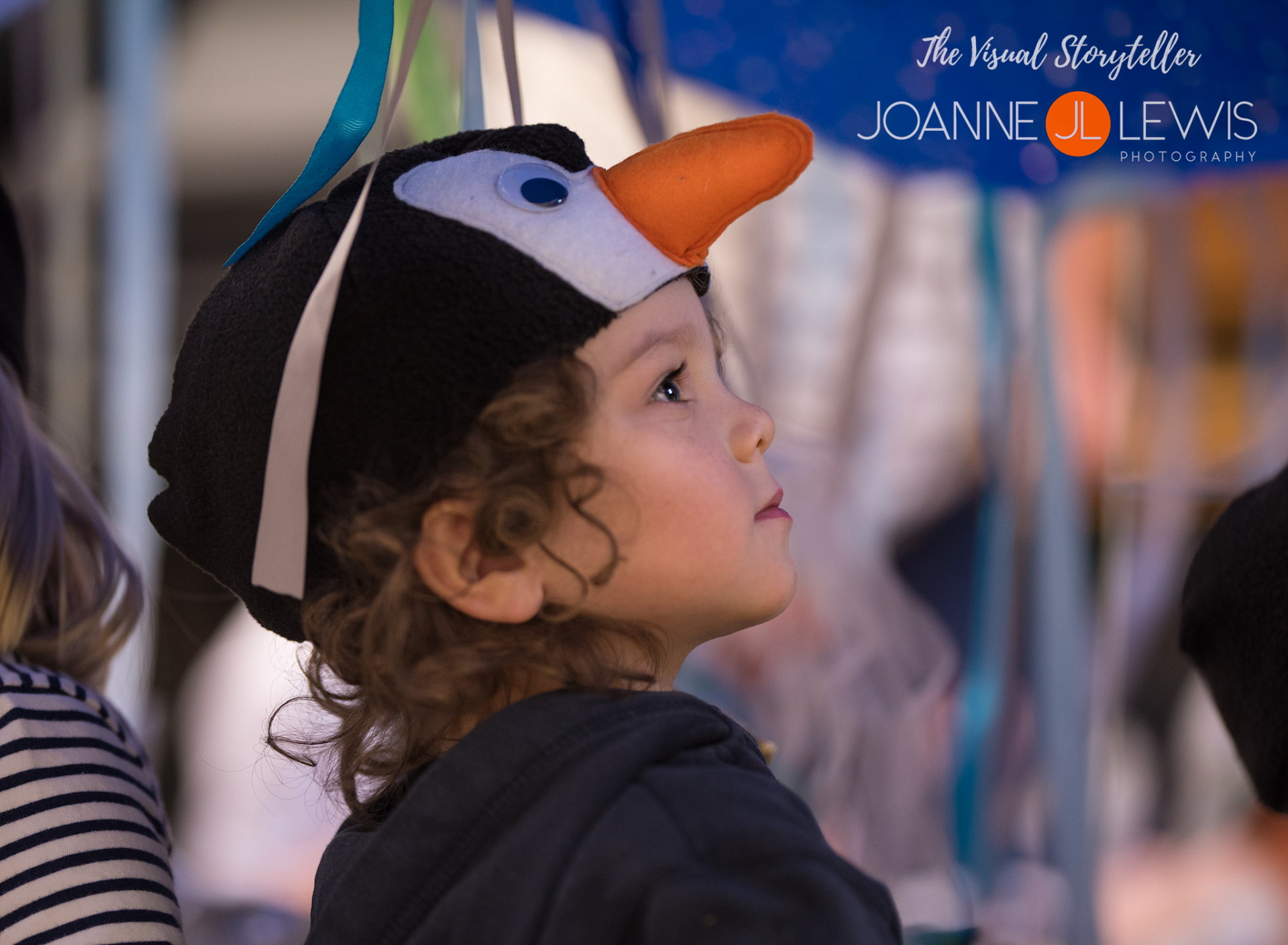 Young boy wearing penguin hat