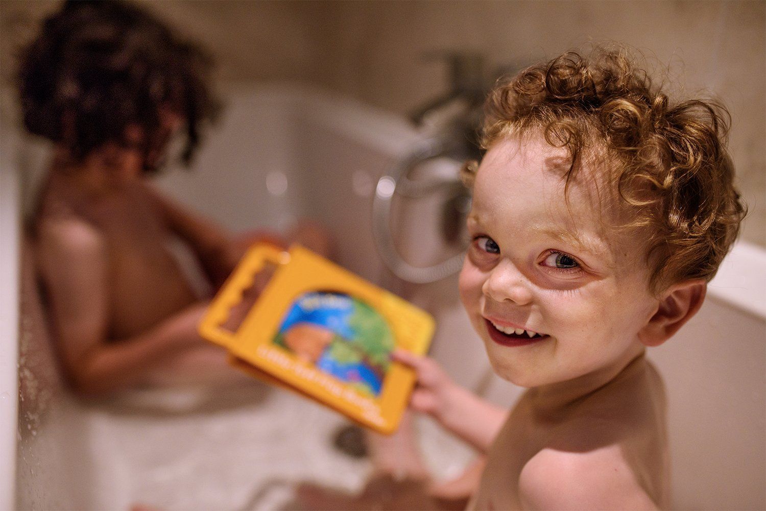 Brothers bathtime with waterproof books