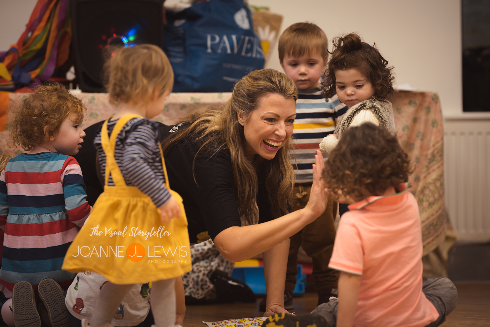 High five from teacher at musical toddler group