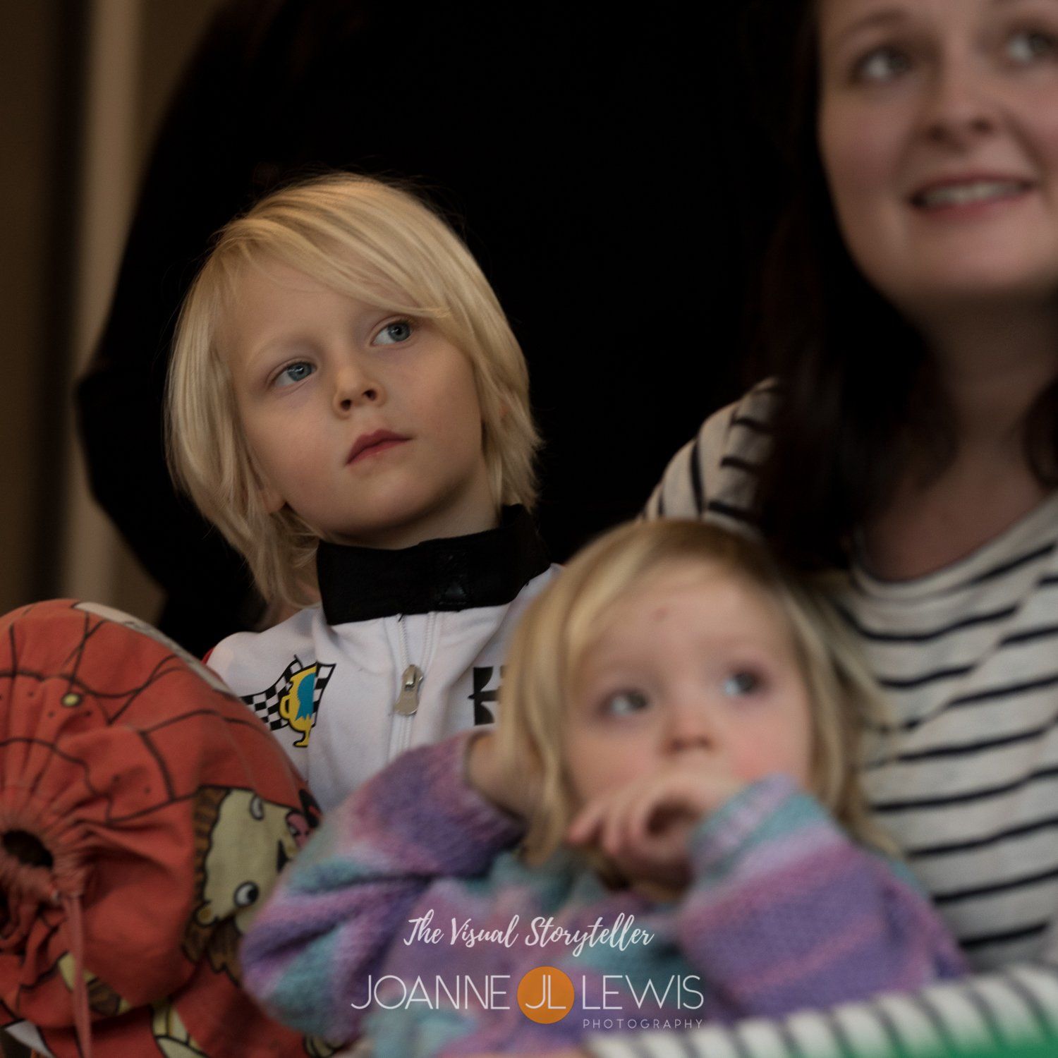 family enjoying party games being photographed at Hertford birthday party